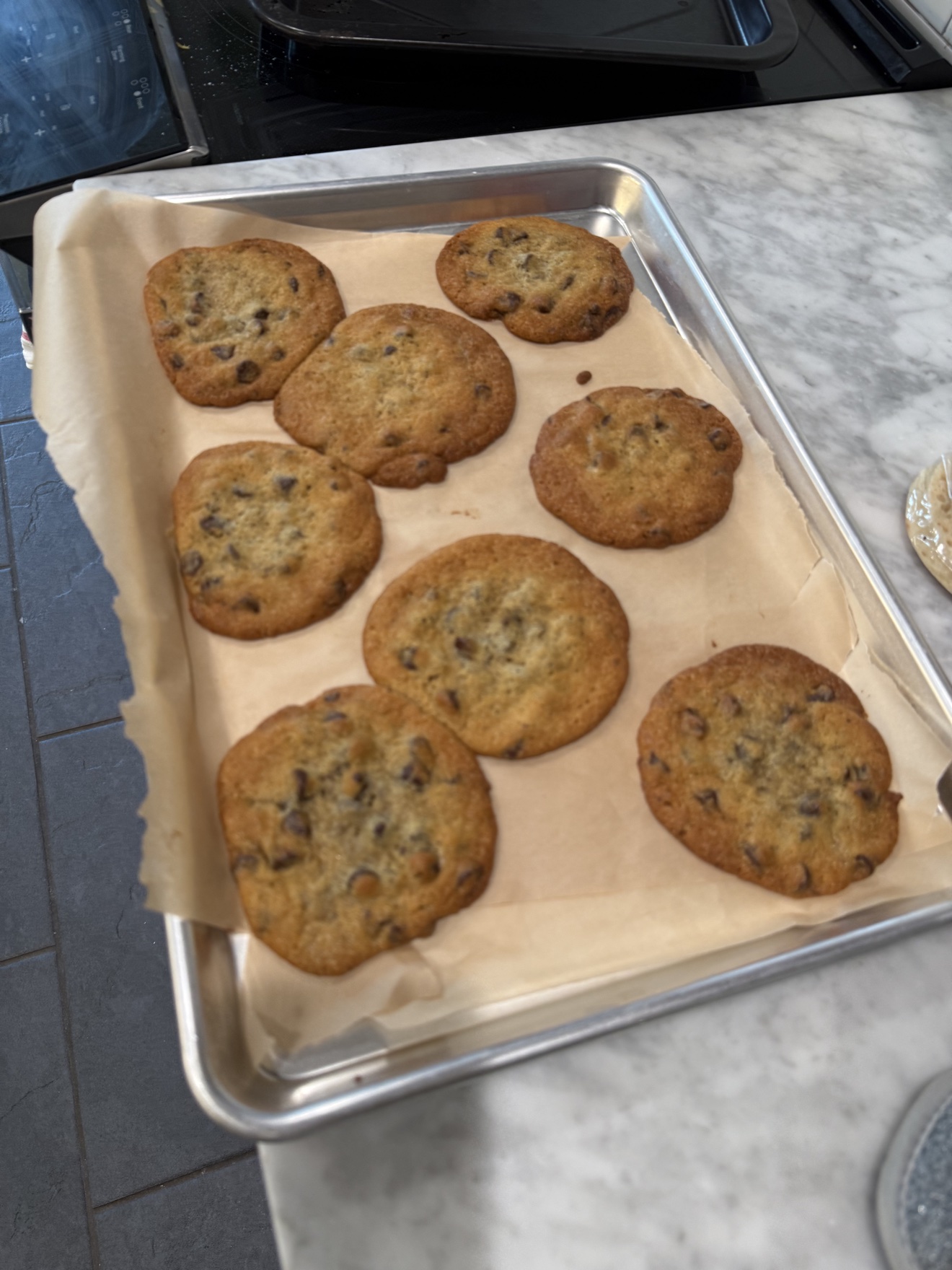 Brown butter cookies cooling on the marble counter