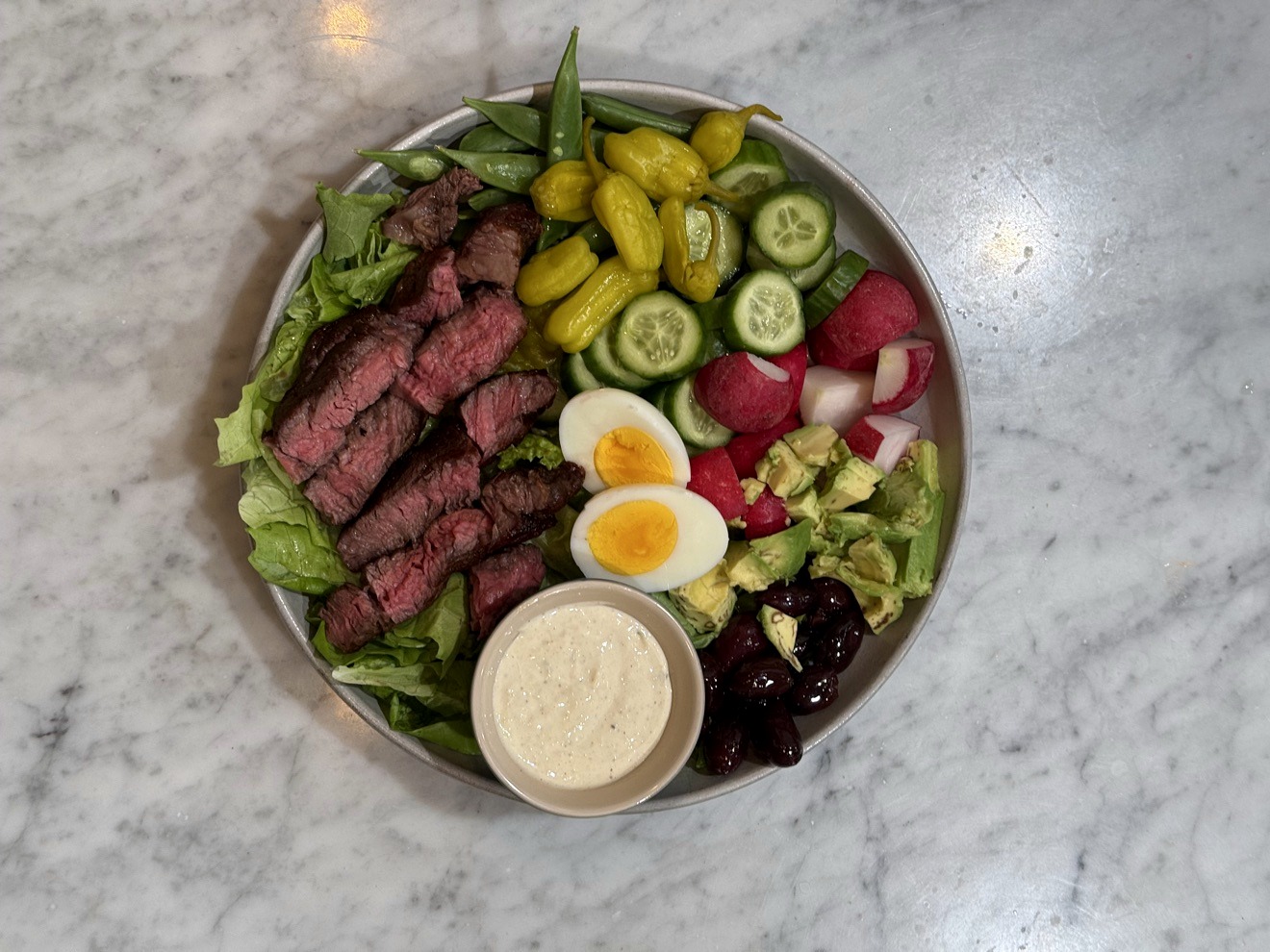 The salad components laid out before building